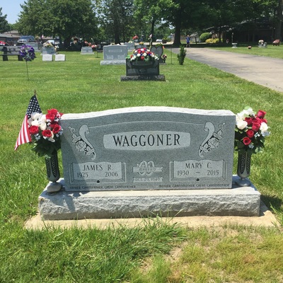 Double upright memorial headstone in gray granite
