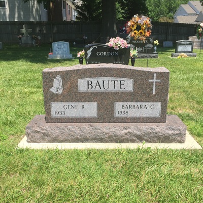 Double upright memorial headstone in mahogany brown granite